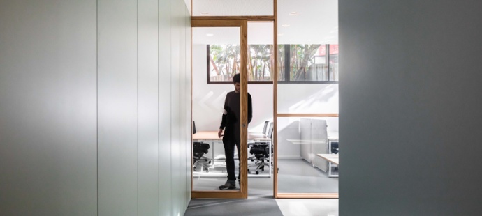 Big house with snow on the ground and roof